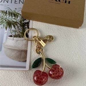Coach Gold Cherry Bag Charm with Red Glitter Cherries and Green Leaves